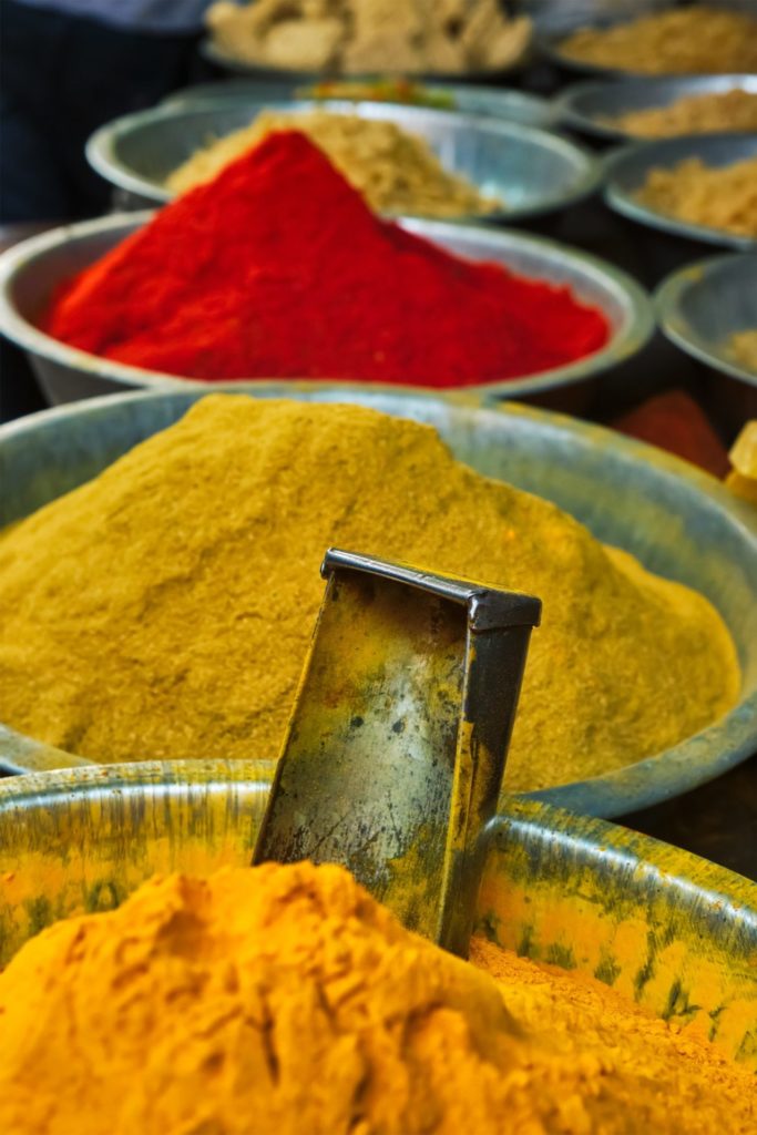 Turmeric curcuma powder and chili powder in spices market in India