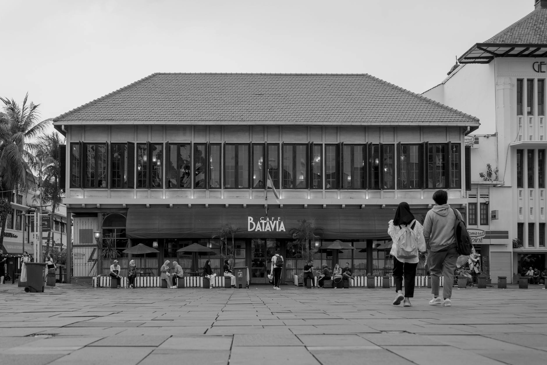 people in front of a cafe